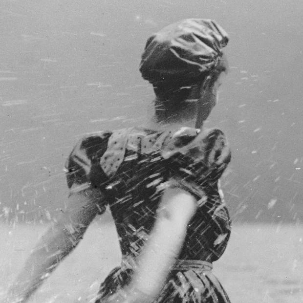 about Woman on beach, splashing water.